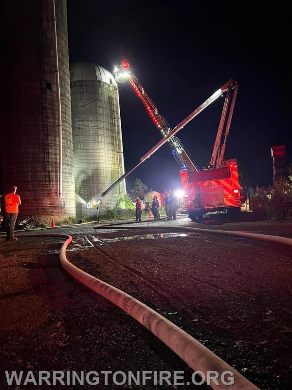 SQ93 maneuvering it's water boom to flow water into the side of the silo